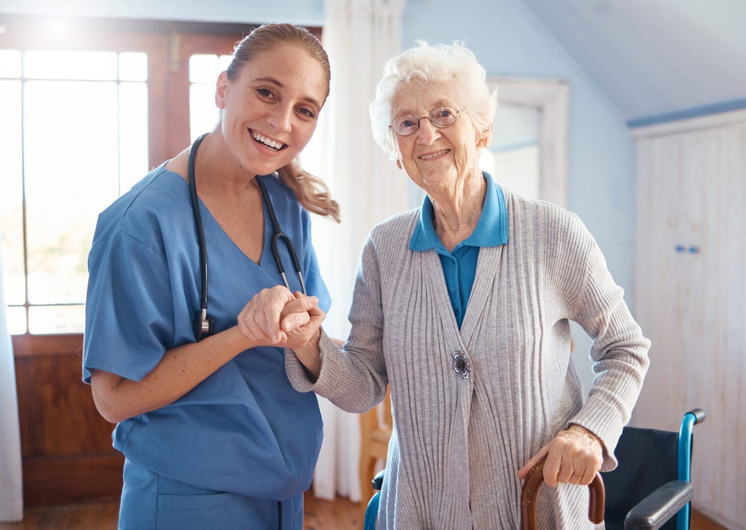 Elderly woman with supportive nurse